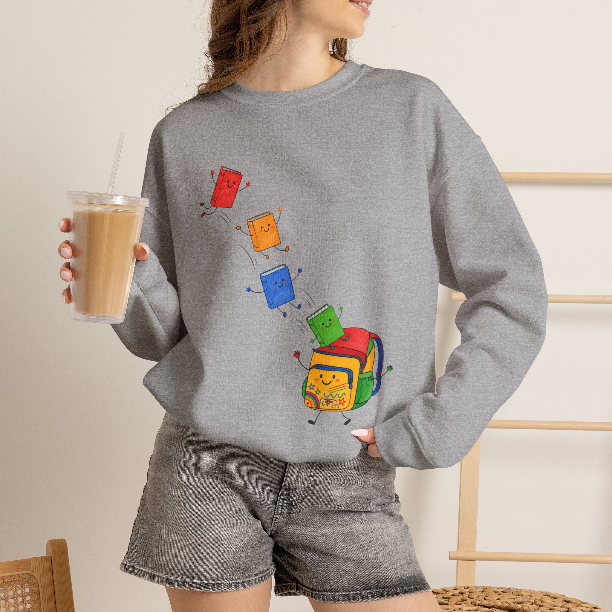 Teacher Backpack and Falling Books Crewneck Sweatshirt — Cute School Supplies Graphic