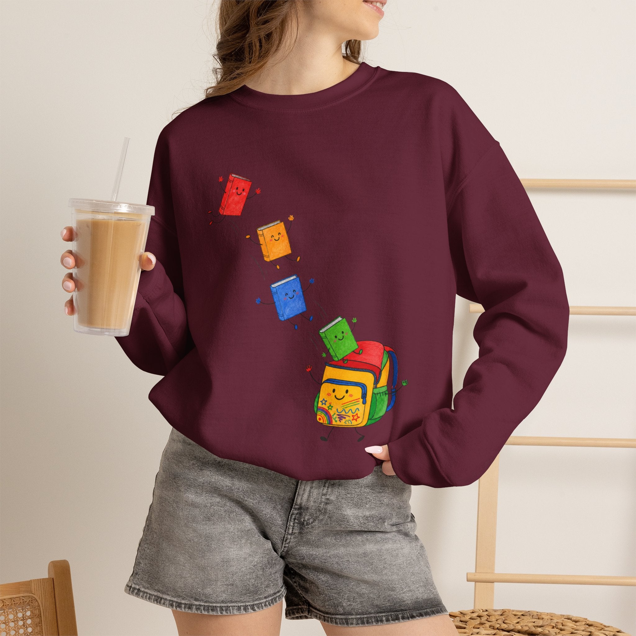 Teacher Backpack and Falling Books Crewneck Sweatshirt — Cute School Supplies Graphic